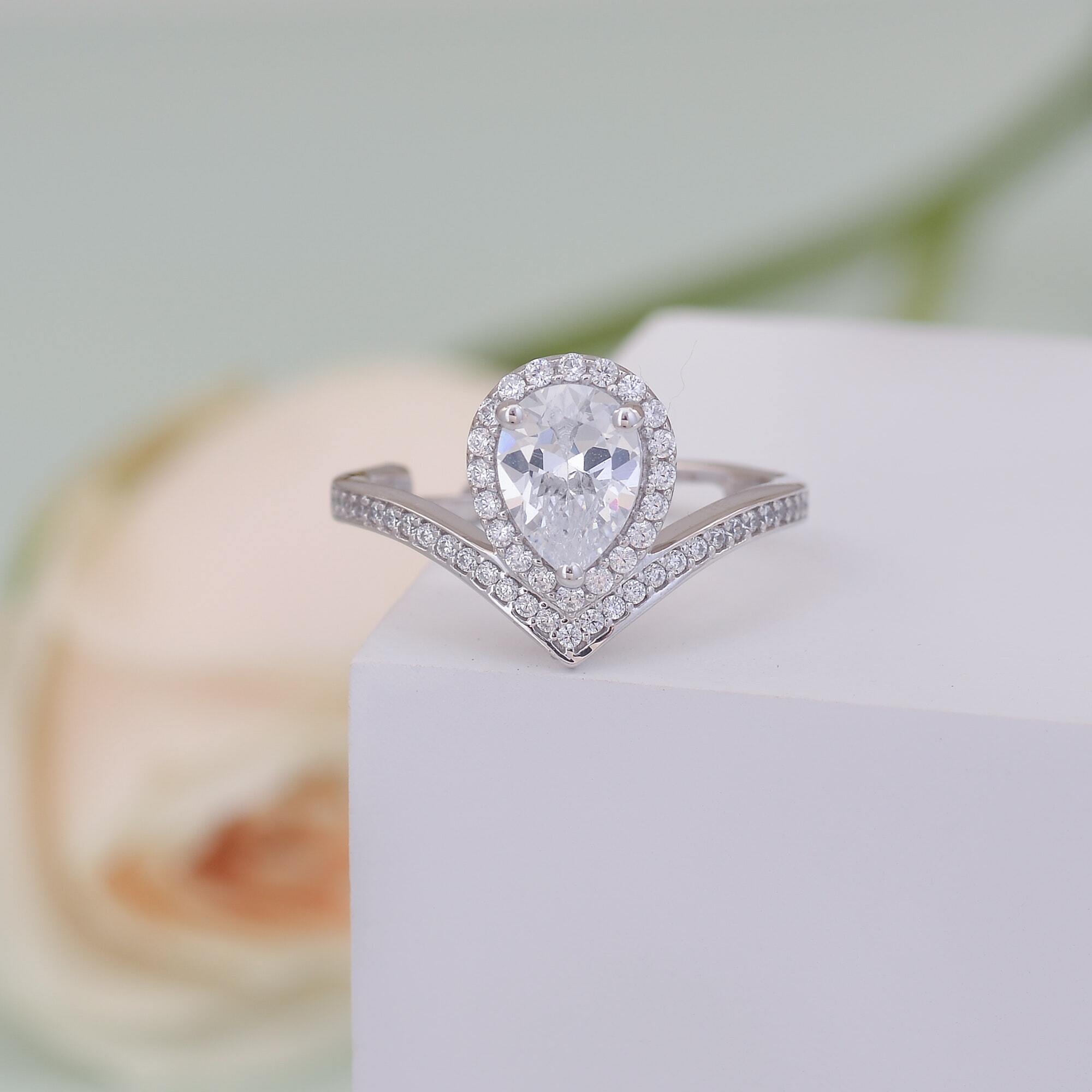 Close-up of hands buying an engagement ring