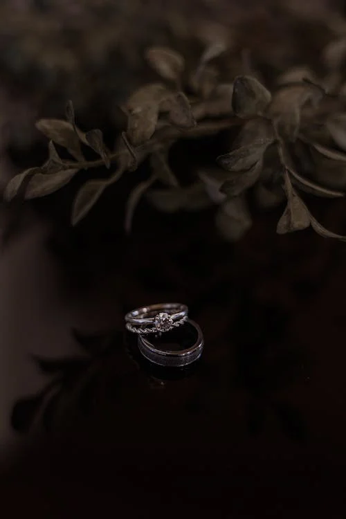 Close-up of engraved platinum wedding bands