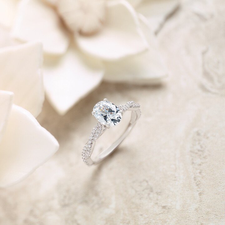 Close-up of hands buying an engagement ring