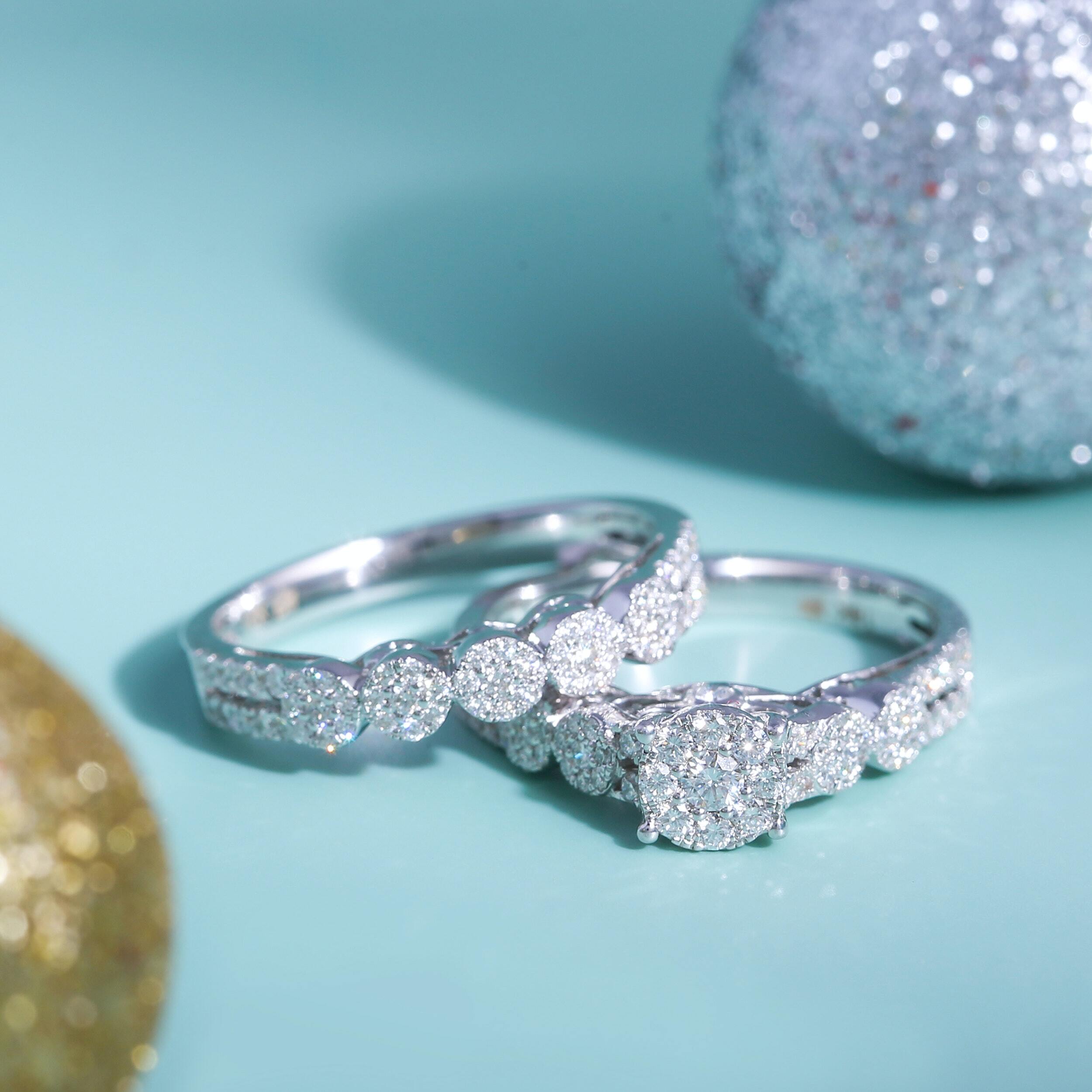 Close-up of hands buying an engagement ring