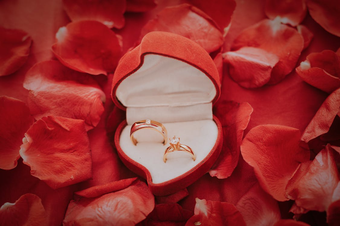 Close-up of hands buying an engagement ring