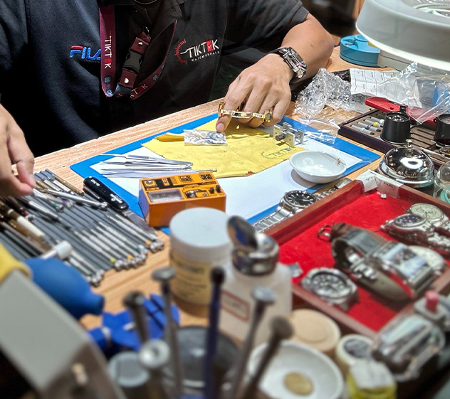 Close-up of a skilled watchmaker repairing a vintage watch