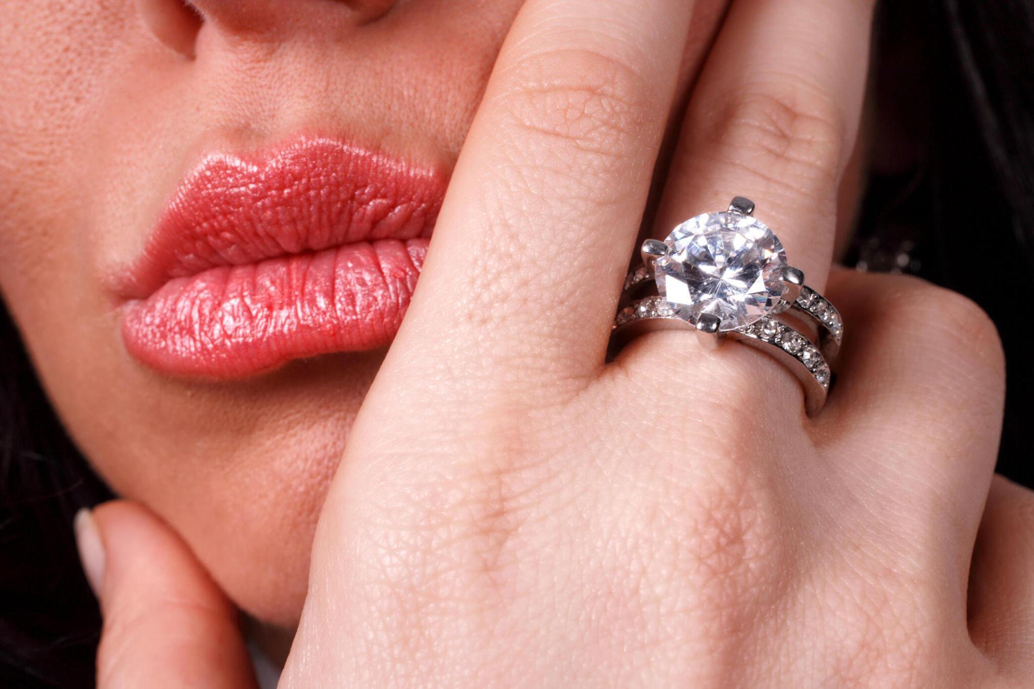 Woman displaying elegant engagement ring