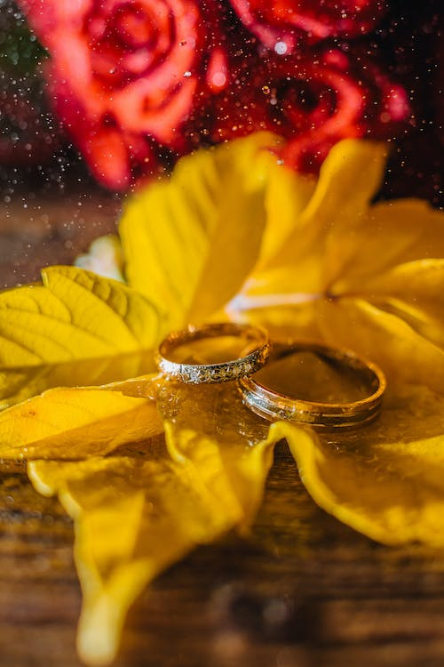 Close-up of hands buying an engagement ring