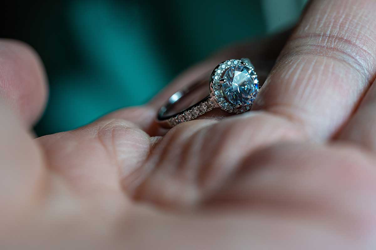 Woman holding an elegant engagement ring