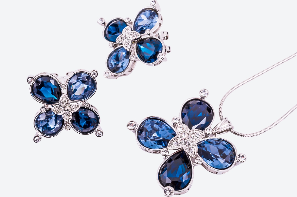 2 Blue gemstone jewelry set with silver accents.
