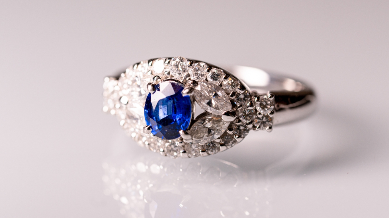 Sapphire and diamond halo engagement ring.