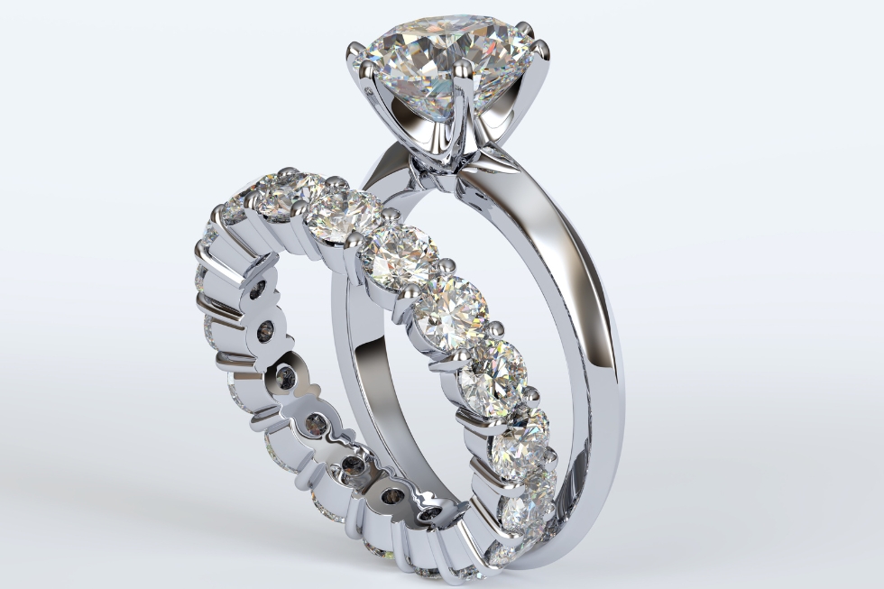 2 White gold diamond engagement and wedding rings.