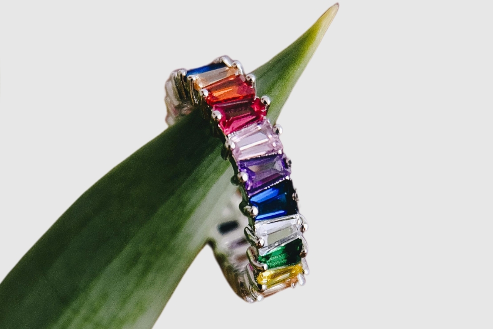 2 Baguette-cut multicolored gemstones.