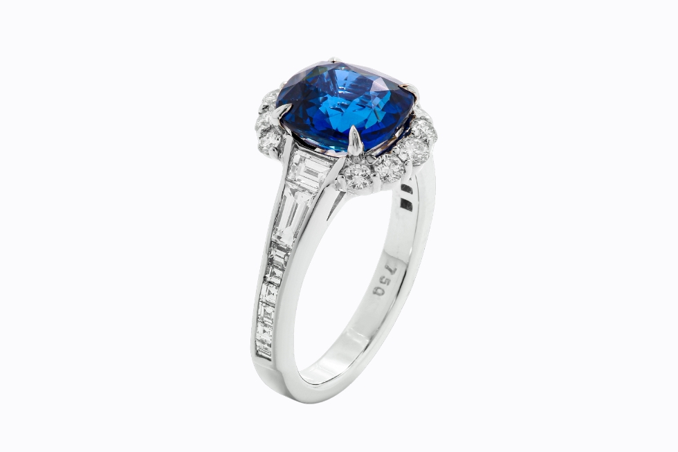 3 White gold sapphire diamond halo ring.