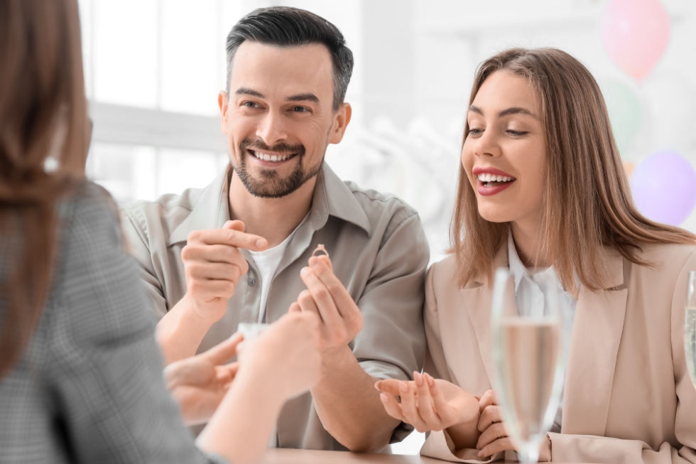 4 Couple excited about engagement ring purchase.