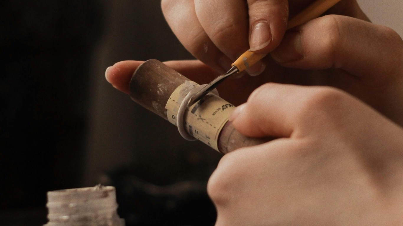 Shaping ring mold using small hand tool.