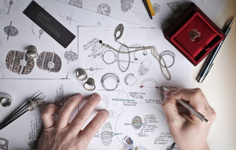 Jewelry design sketches and prototypes.