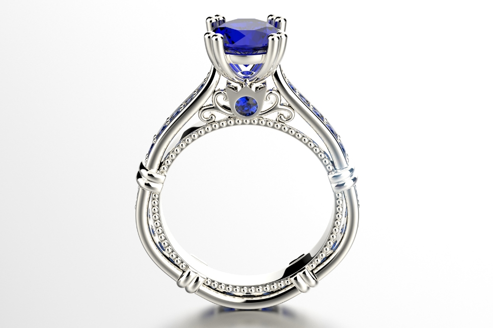 White gold engagement ring with blue sapphire.