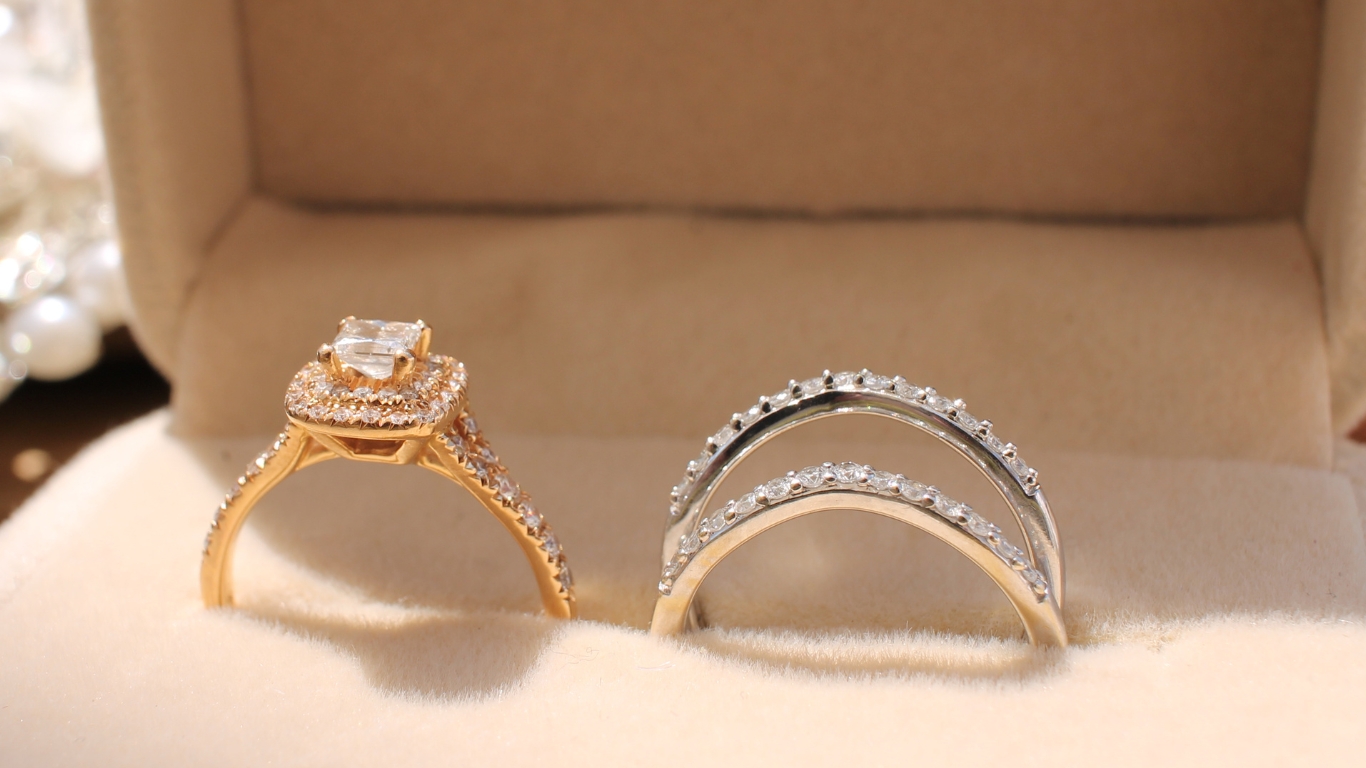 Gold and silver diamond engagement and wedding rings.