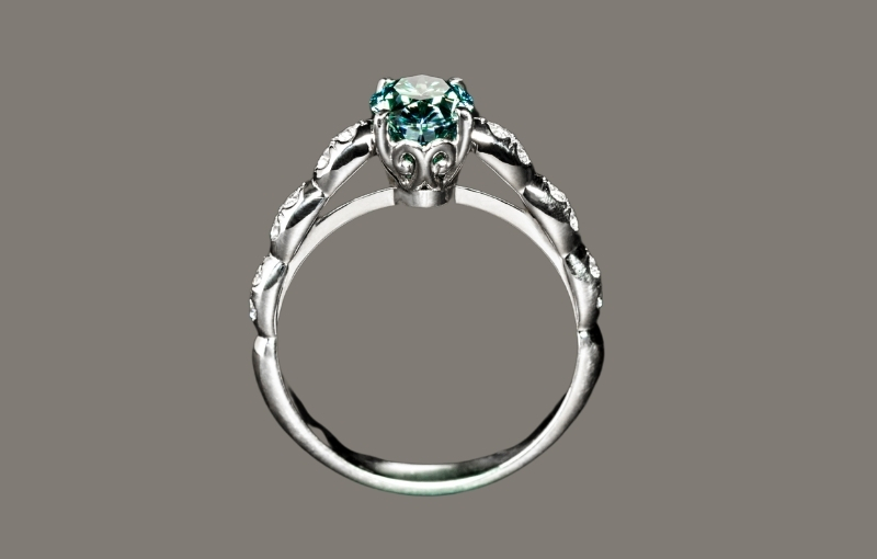 Vintage-style silver ring with emerald gemstone.