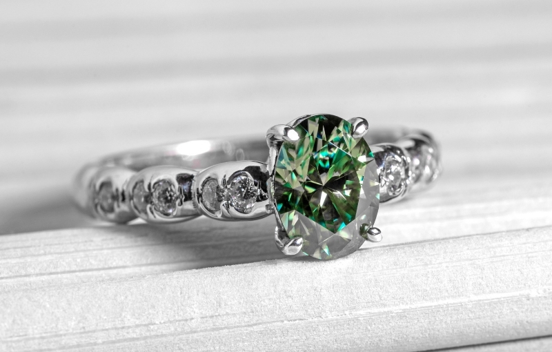 Green oval gemstone vintage-style ring.