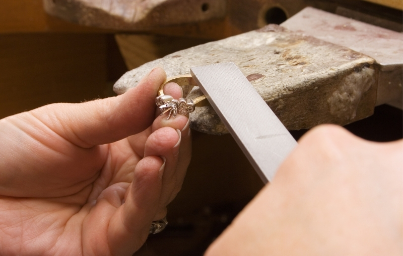 4 Jeweler crafting a ring.