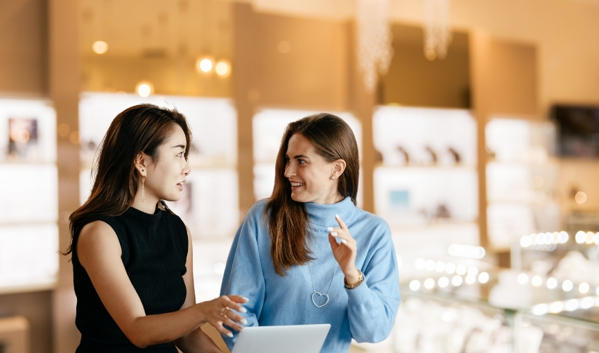 Jewelry consultation with two women.