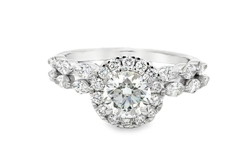 Art Deco and Edwardian designs round center diamond.