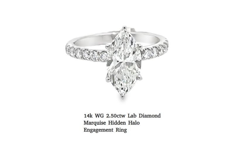 Vintage marquise diamond ring with pavé band.
