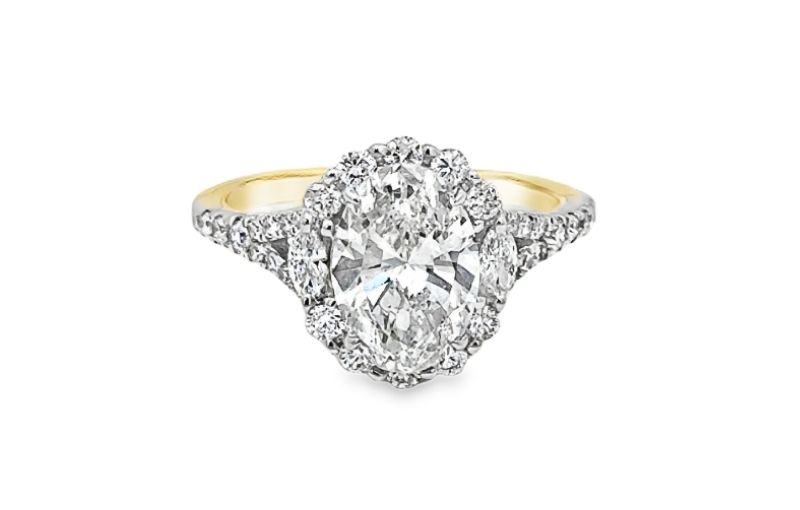 Edwardian-style oval diamond halo ring.