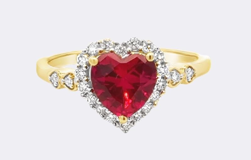 Gold heart-shaped ruby diamond ring.