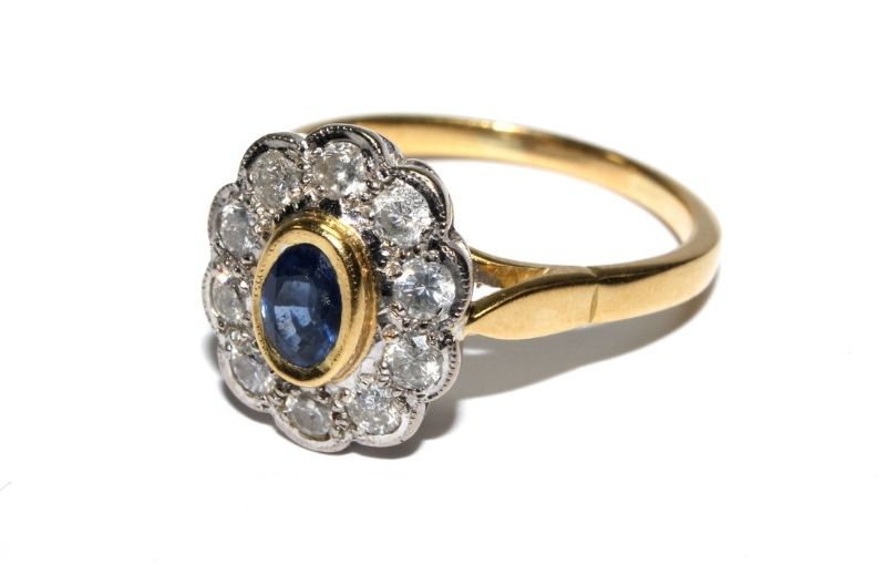 Antique-style sapphire halo ring.<br />
