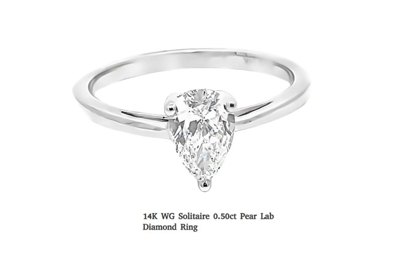14k white gold pear diamond ring.