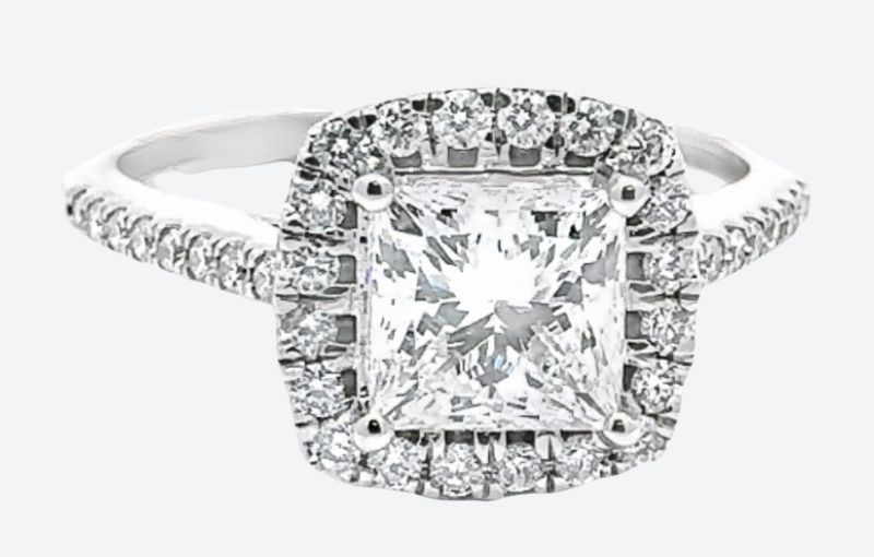 Princess cut diamond halo engagement ring.