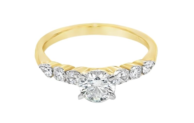 Yellow gold diamond ring with accents.