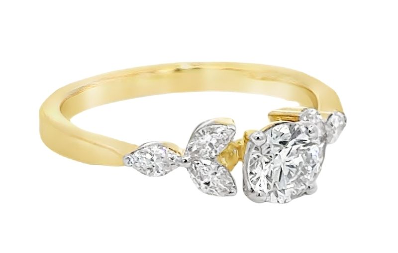 Yellow gold diamond ring with side stones.