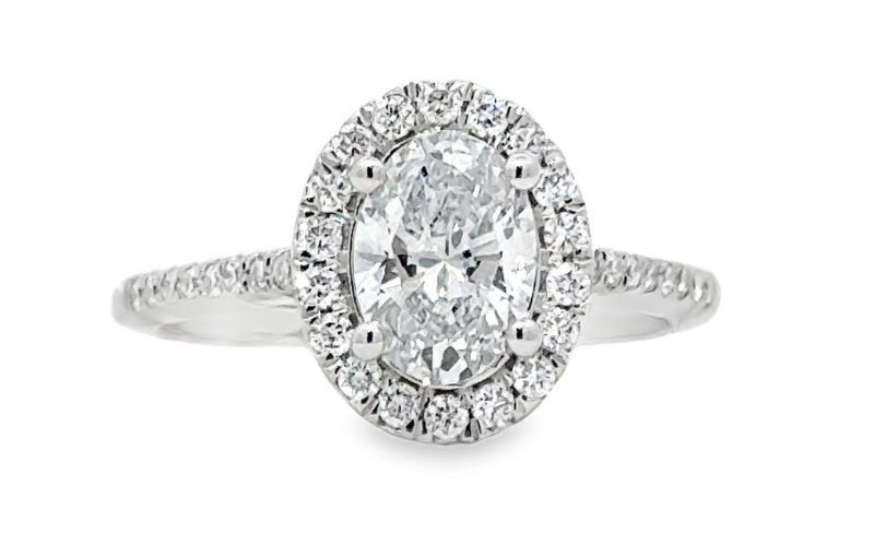 Oval diamond halo engagement ring.