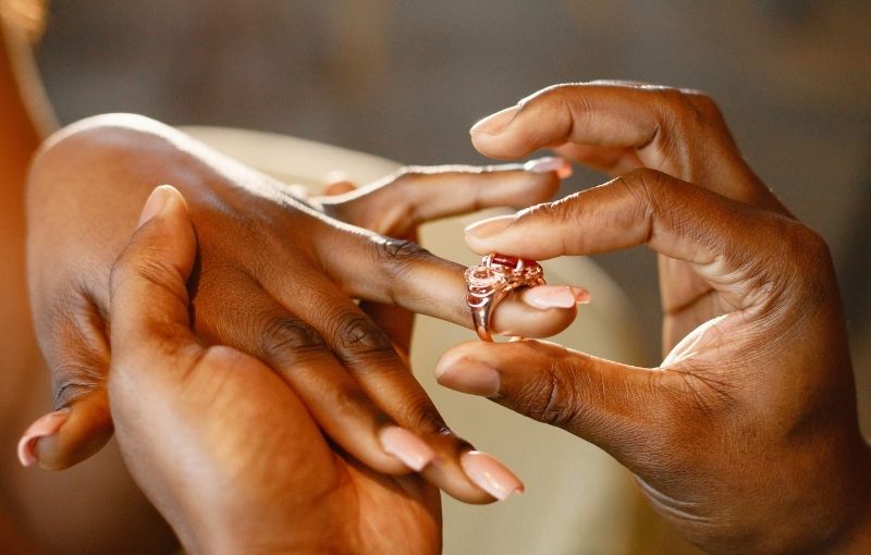 Rose gold engagement ring proposal moment.