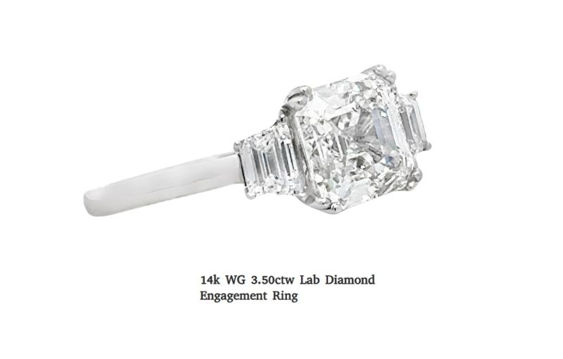 14k white gold emerald diamond ring.