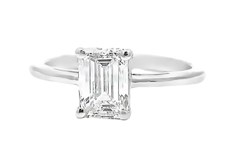 Emerald-cut diamond solitaire ring.