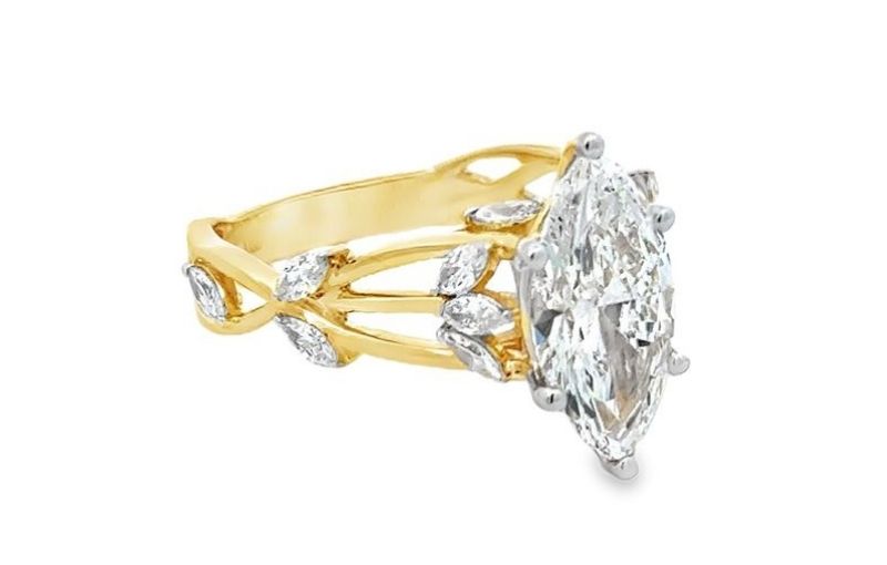 Marquise diamond ring with gold band.