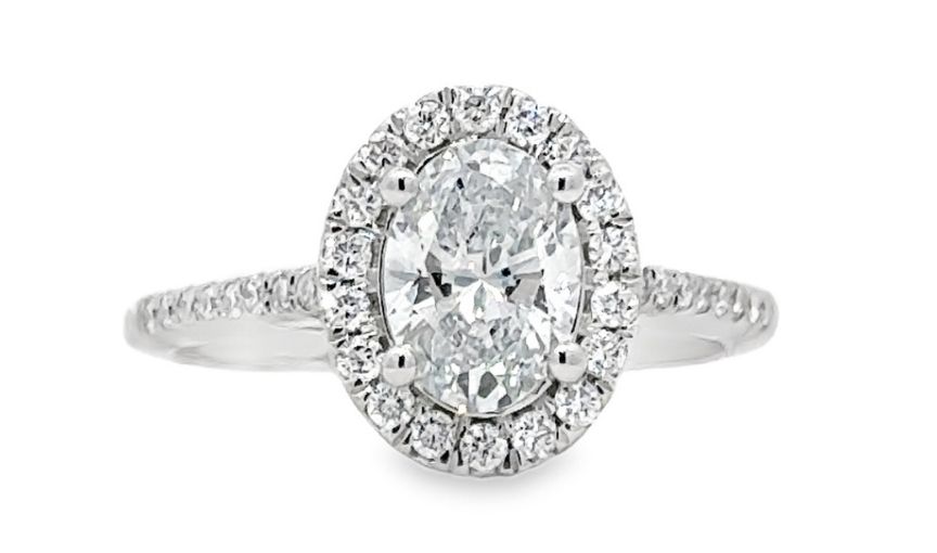 Oval diamond halo engagement ring.