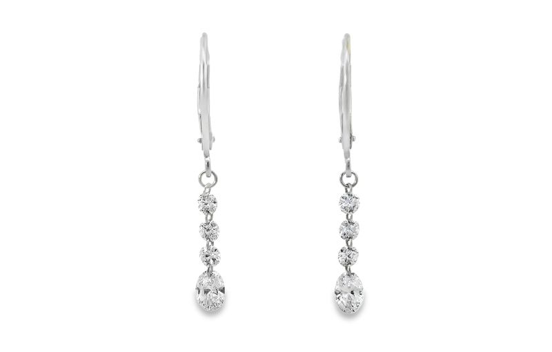 Three-stone diamond dangle earrings.<br />
