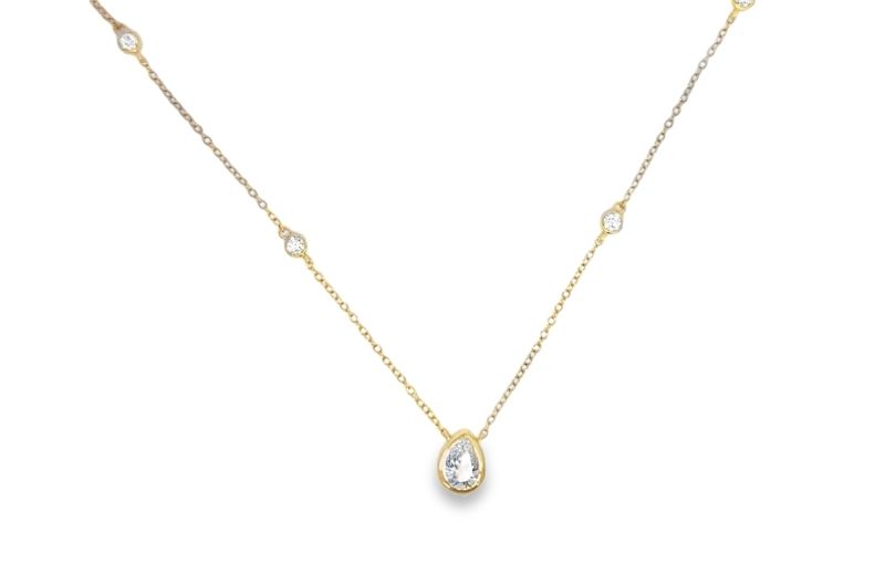Gold necklace with diamond pendant.<br />
