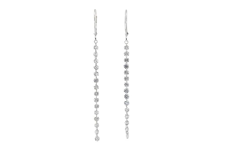 Long diamond drop earrings in silver.<br />
