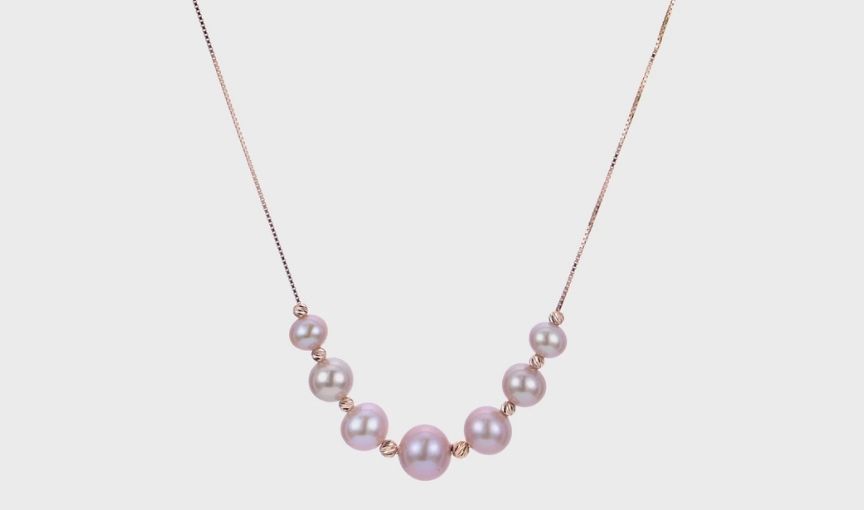 Pink pearl necklace with gold.