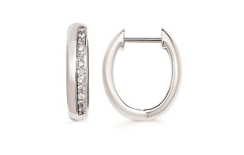 Diamond-studded silver hoop earrings.<br />
