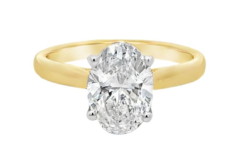 Oval diamond gold engagement ring.