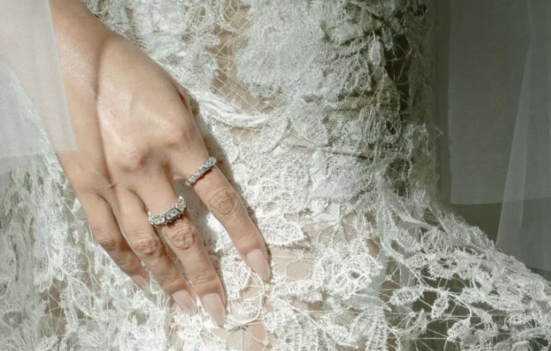 Close-up of wedding rings on lace.<br />
