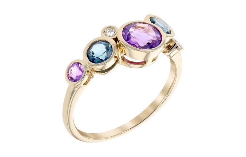 Multi-colored gemstone ring in gold.
