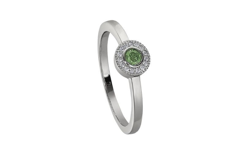 White gold ring with green gemstone.