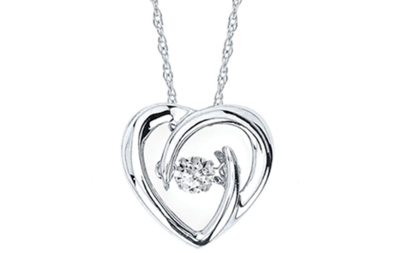 Silver heart pendant with central diamond.<br />

