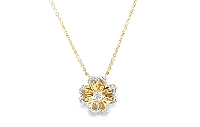 Floral diamond pendant necklace in gold.<br />
