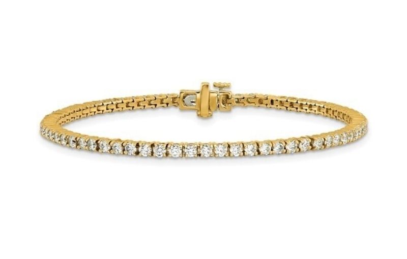 Yellow gold diamond tennis bracelet.<br />

